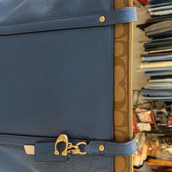Blue leather Coach tote with brown signature strip on top. - Picture 6 of 7
